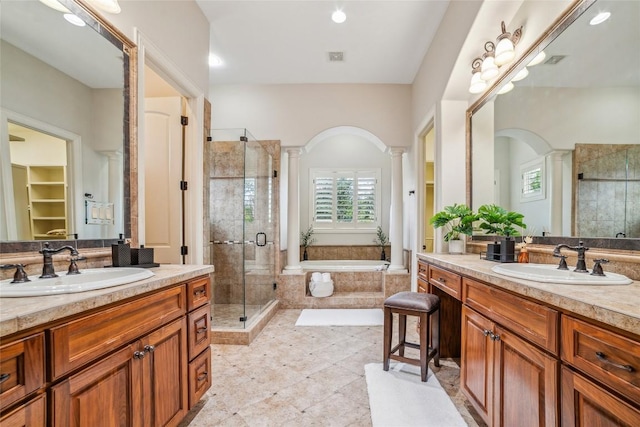 12529 Verandah Ct, Austin, TX 78726 - bathroom with two vanities, a shower stall, a bath, ornate columns, and recessed lighting