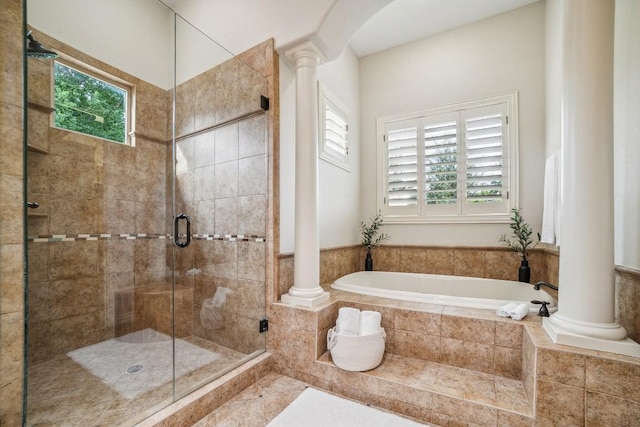 12529 Verandah Ct, Austin, TX 78726 - bathroom with decorative columns, plenty of natural light, a bath, and a shower stall