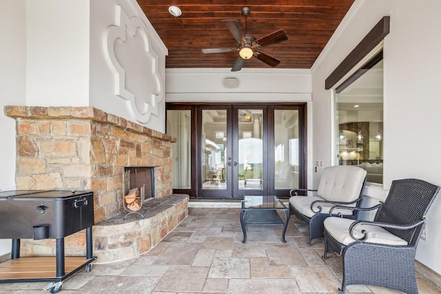 12529 Verandah Ct, Austin, TX 78726 - view of patio / terrace with french doors, a stone fireplace, and ceiling fan