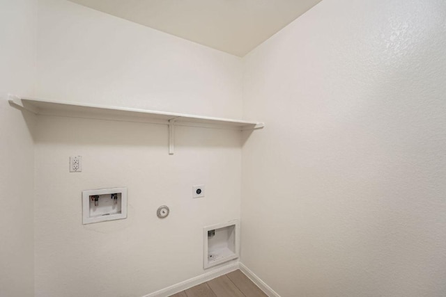 14309 Deaf Smith Blvd, Austin, TX 78725 - washroom featuring electric dryer hookup, gas dryer hookup, hookup for a washing machine, baseboards, and wood finished floors