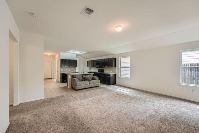 14309 Deaf Smith Blvd, Austin, TX 78725 - unfurnished living room with light carpet and baseboards