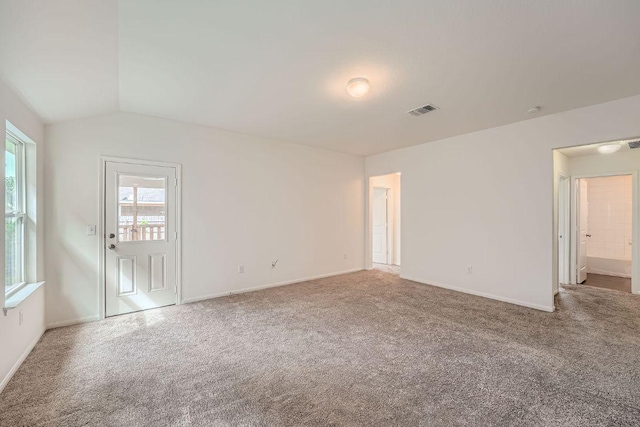 14309 Deaf Smith Blvd, Austin, TX 78725 - carpeted spare room featuring lofted ceiling and baseboards