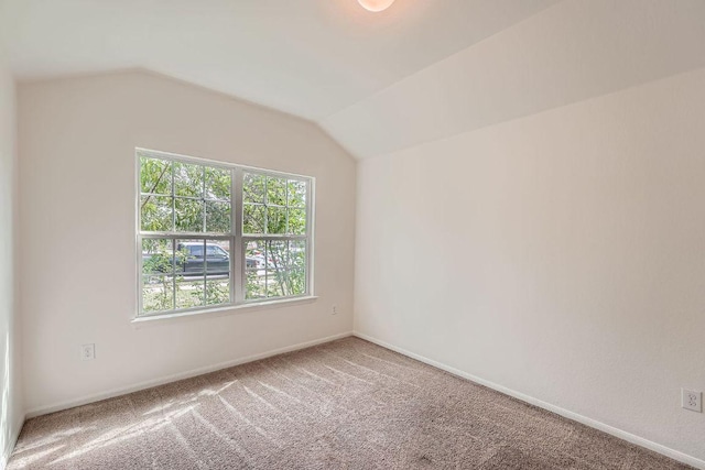 14309 Deaf Smith Blvd, Austin, TX 78725 - carpeted spare room with vaulted ceiling and baseboards