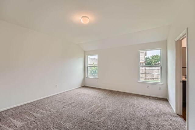 14309 Deaf Smith Blvd, Austin, TX 78725 - empty room with carpet, lofted ceiling, and baseboards