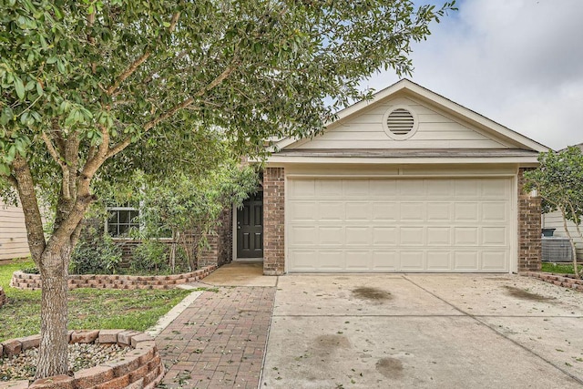 14309 Deaf Smith Blvd, Austin, TX 78725 - ranch-style house featuring concrete driveway, brick siding, central air condition unit, and a garage