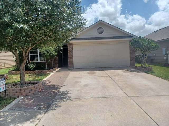 14309 Deaf Smith Blvd, Austin, TX 78725 - ranch-style house featuring brick siding, concrete driveway, and an attached garage