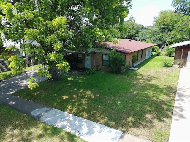 200 W Odell St, Austin, TX 78752 - view of front of property with a front lawn and brick siding