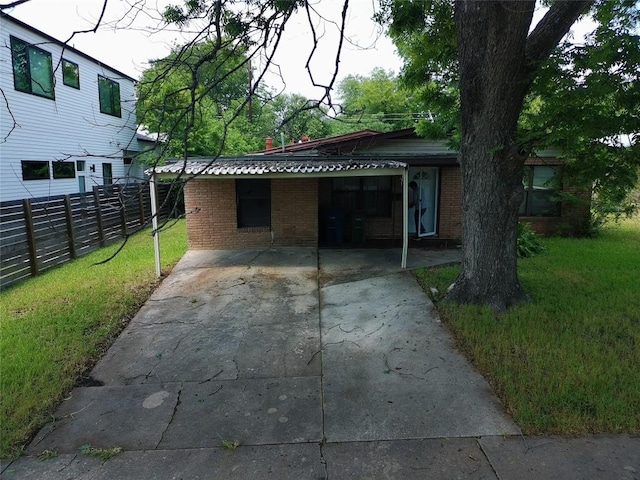 200 W Odell St, Austin, TX 78752 - view of front of house with brick siding and driveway