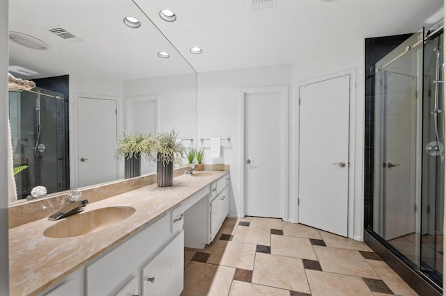 7701 Lowdes Dr, Austin, TX 78745 - bathroom with recessed lighting, double vanity, and a stall shower