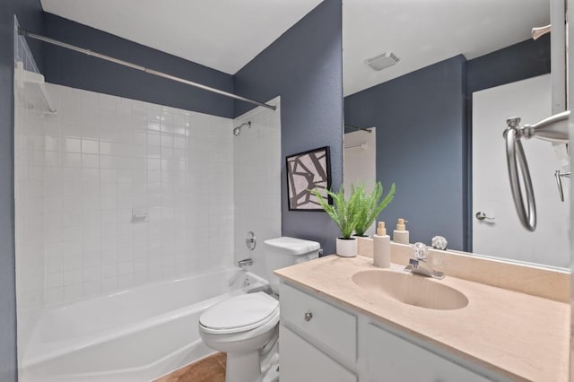 7701 Lowdes Dr, Austin, TX 78745 - bathroom featuring toilet, vanity, washtub / shower combination, and tile patterned flooring