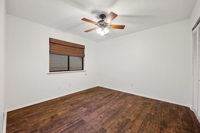 7701 Lowdes Dr, Austin, TX 78745 - unfurnished bedroom with wood finished floors, a closet, baseboards, and ceiling fan