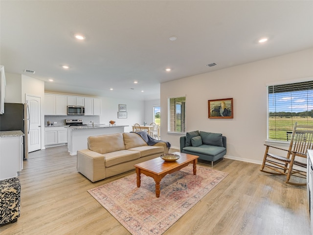 102 Sandpiper Dr, Bastrop, TX 78602 - living room with plenty of natural light, light wood finished floors, and recessed lighting