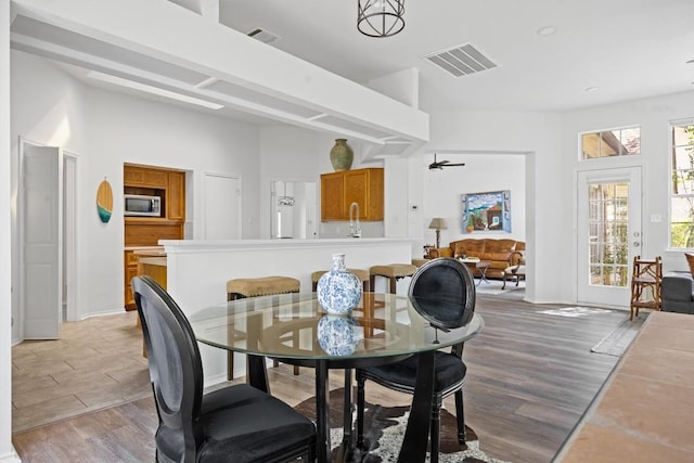 9205 Amanda Dr, Austin, TX 78729 - dining area with light wood-style floors and baseboards