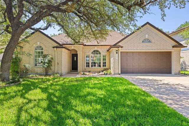 9205 Amanda Dr, Austin, TX 78729 - ranch-style house with brick siding, a garage, driveway, a front lawn, and roof with shingles