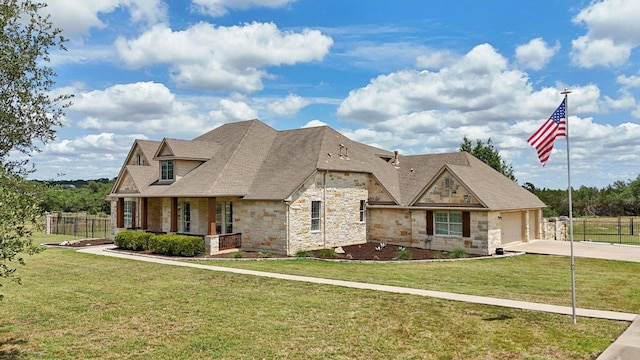 816 Drifting Wind Run, Dripping Springs, TX 78620 - view of front of property featuring stone siding, concrete driveway, an attached garage, and a porch