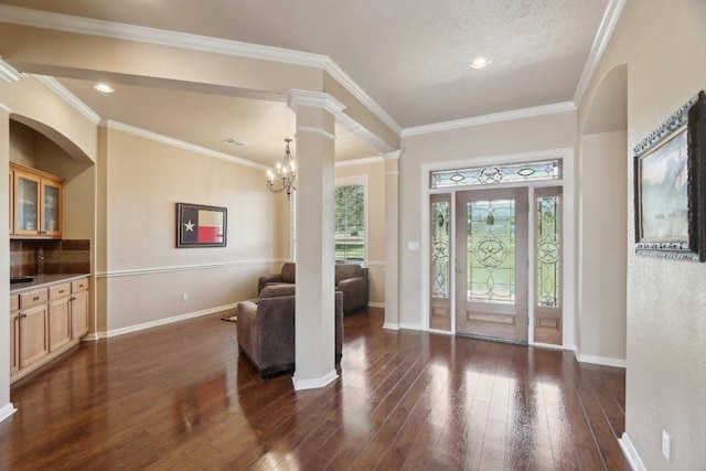 816 Drifting Wind Run, Dripping Springs, TX 78620 - foyer entrance with dark wood-style floors, baseboards, decorative columns, crown molding, and recessed lighting