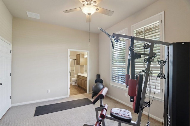816 Drifting Wind Run, Dripping Springs, TX 78620 - exercise area featuring light colored carpet, ceiling fan, and baseboards