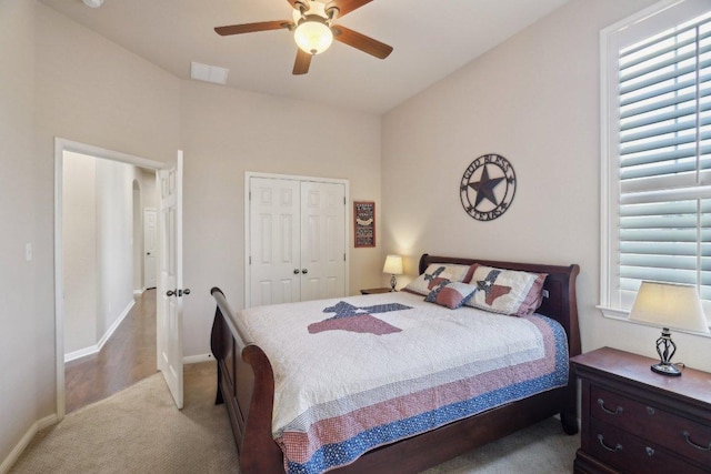 816 Drifting Wind Run, Dripping Springs, TX 78620 - bedroom with carpet flooring, a closet, baseboards, and ceiling fan