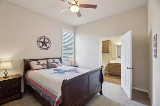 816 Drifting Wind Run, Dripping Springs, TX 78620 - bedroom with light carpet, ensuite bathroom, baseboards, and a ceiling fan
