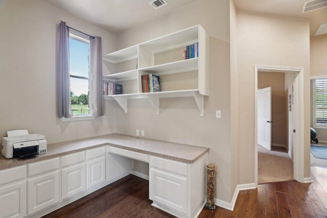 816 Drifting Wind Run, Dripping Springs, TX 78620 - unfurnished office with built in study area, dark wood-type flooring, healthy amount of natural light, and baseboards