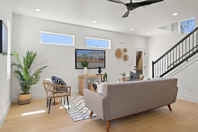 1212 Poquito St, Austin, TX 78702 - living area with wood finished floors, a ceiling fan, stairway, recessed lighting, and baseboards