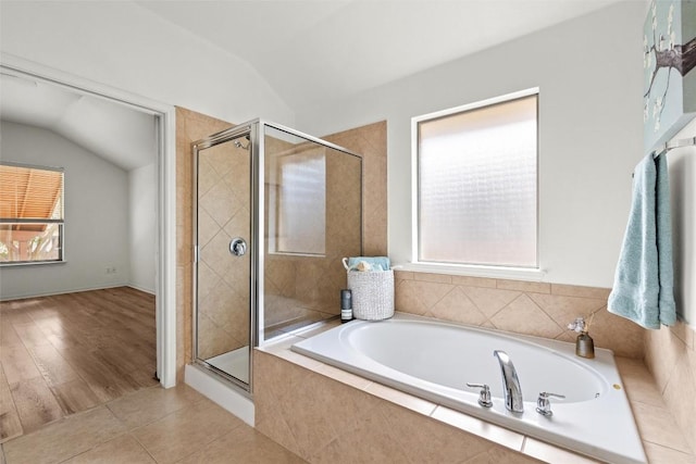 260 Kiras Ct, Austin, TX 78737 - full bathroom with lofted ceiling, a bath, a stall shower, and tile patterned flooring
