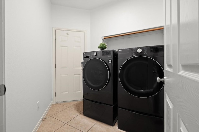 260 Kiras Ct, Austin, TX 78737 - washroom with independent washer and dryer, light tile patterned flooring, and baseboards