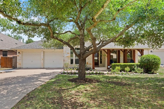 260 Kiras Ct, Austin, TX 78737 - view of front of home featuring a garage, concrete driveway, roof with shingles, and covered porch