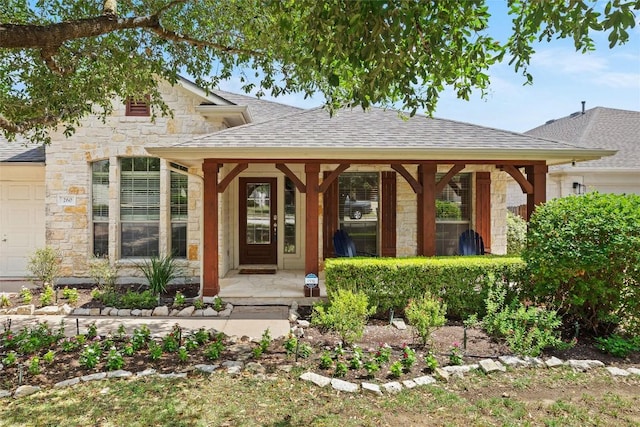 260 Kiras Ct, Austin, TX 78737 - property entrance with stone siding, roof with shingles, and covered porch