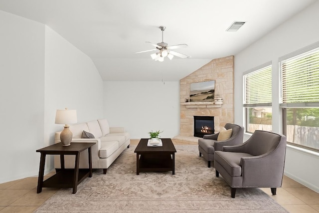 260 Kiras Ct, Austin, TX 78737 - living room featuring light tile patterned floors, lofted ceiling, ceiling fan, and a fireplace