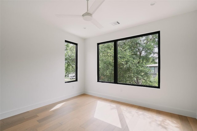 7809 Hardy Dr, Austin, TX 78757 - unfurnished room featuring light wood-type flooring and a ceiling fan
