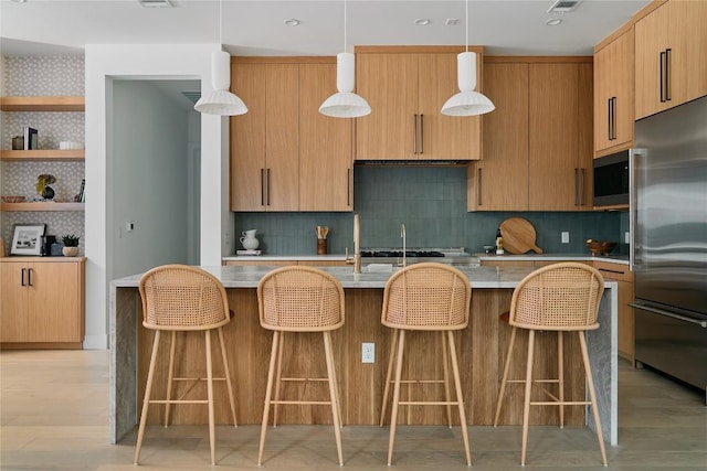 7809 Hardy Dr, Austin, TX 78757 - kitchen featuring stainless steel appliances, decorative backsplash, and light countertops