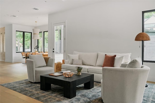 7809 Hardy Dr, Austin, TX 78757 - living area featuring plenty of natural light and wood finished floors