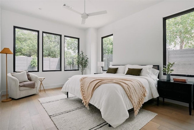 7809 Hardy Dr, Austin, TX 78757 - bedroom with light wood-type flooring and a ceiling fan