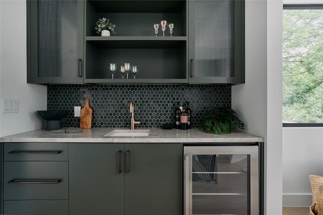 7809 Hardy Dr, Austin, TX 78757 - indoor wet bar with beverage cooler and decorative backsplash