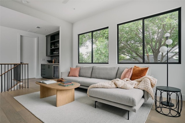 7809 Hardy Dr, Austin, TX 78757 - living area with light wood-type flooring and beverage cooler