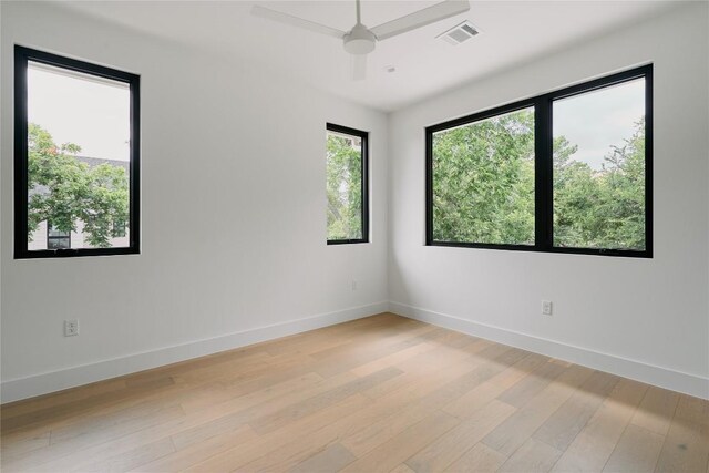7809 Hardy Dr, Austin, TX 78757 - unfurnished room with light wood-style flooring and a ceiling fan