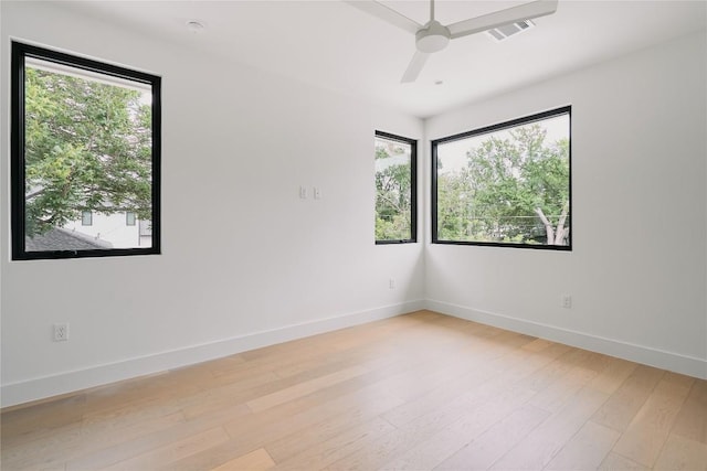 7809 Hardy Dr, Austin, TX 78757 - empty room with light wood-style floors and a ceiling fan
