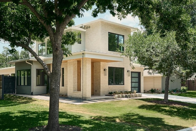 7809 Hardy Dr, Austin, TX 78757 - view of front of property featuring brick siding and a front yard