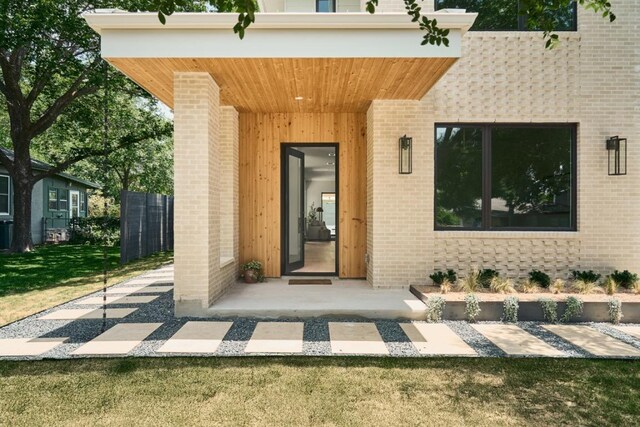 7809 Hardy Dr, Austin, TX 78757 - entrance to property featuring brick siding and a lawn