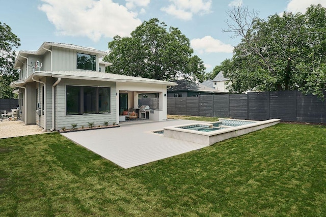 7809 Hardy Dr, Austin, TX 78757 - back of house featuring a patio, a fenced backyard, and a pool with connected hot tub
