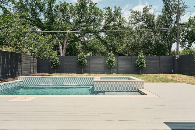 7809 Hardy Dr, Austin, TX 78757 - view of pool featuring a fenced backyard, a wooden deck, and a pool with connected hot tub