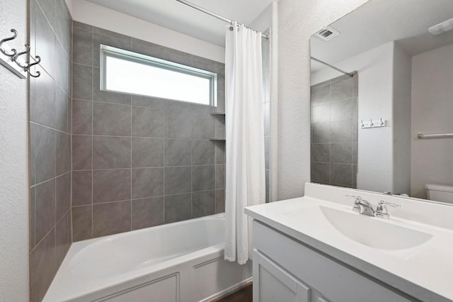 5817 Bell Tower Ln, Austin, TX 78747 - bathroom featuring shower / tub combo, toilet, and vanity