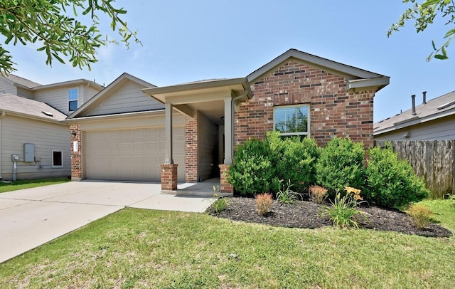 5817 Bell Tower Ln, Austin, TX 78747 - view of front of home with brick siding, an attached garage, and driveway