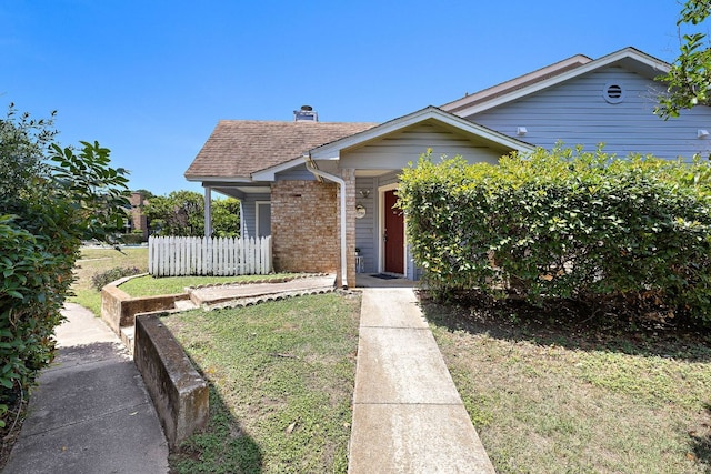 1601 Faro Dr Unit 303, Austin, TX 78741 - bungalow-style house with brick siding and a shingled roof