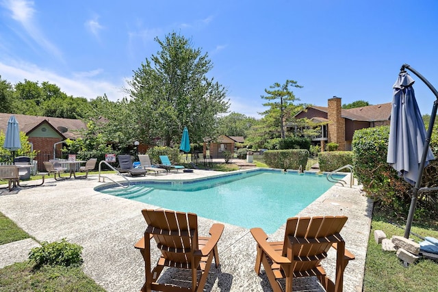 1601 Faro Dr Unit 303, Austin, TX 78741 - community pool featuring a patio