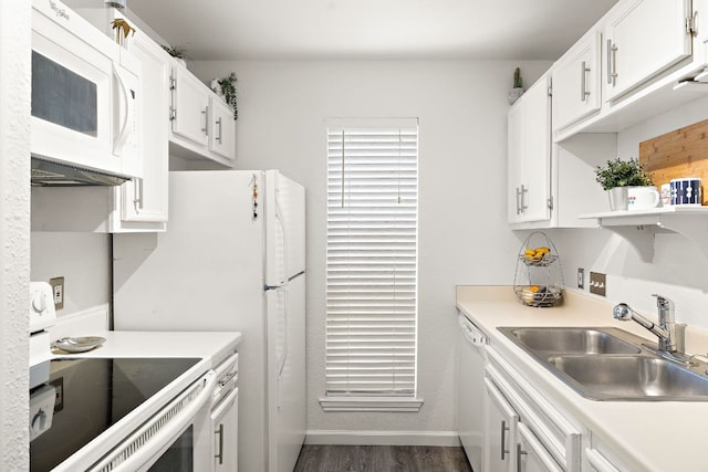 1601 Faro Dr Unit 303, Austin, TX 78741 - kitchen with white appliances, a sink, white cabinets, and dark wood-style floors