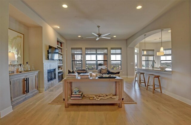8200 SW Pkwy Unit 721, Austin, TX 78735 - office area featuring ceiling fan, recessed lighting, baseboards, wood finished floors, and built in shelves