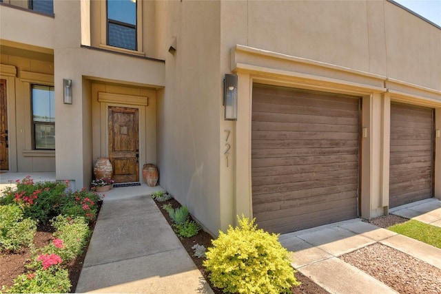 8200 SW Pkwy Unit 721, Austin, TX 78735 - doorway to property featuring a garage and stucco siding