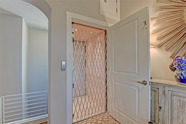 8200 SW Pkwy Unit 721, Austin, TX 78735 - entryway featuring elevator and arched walkways